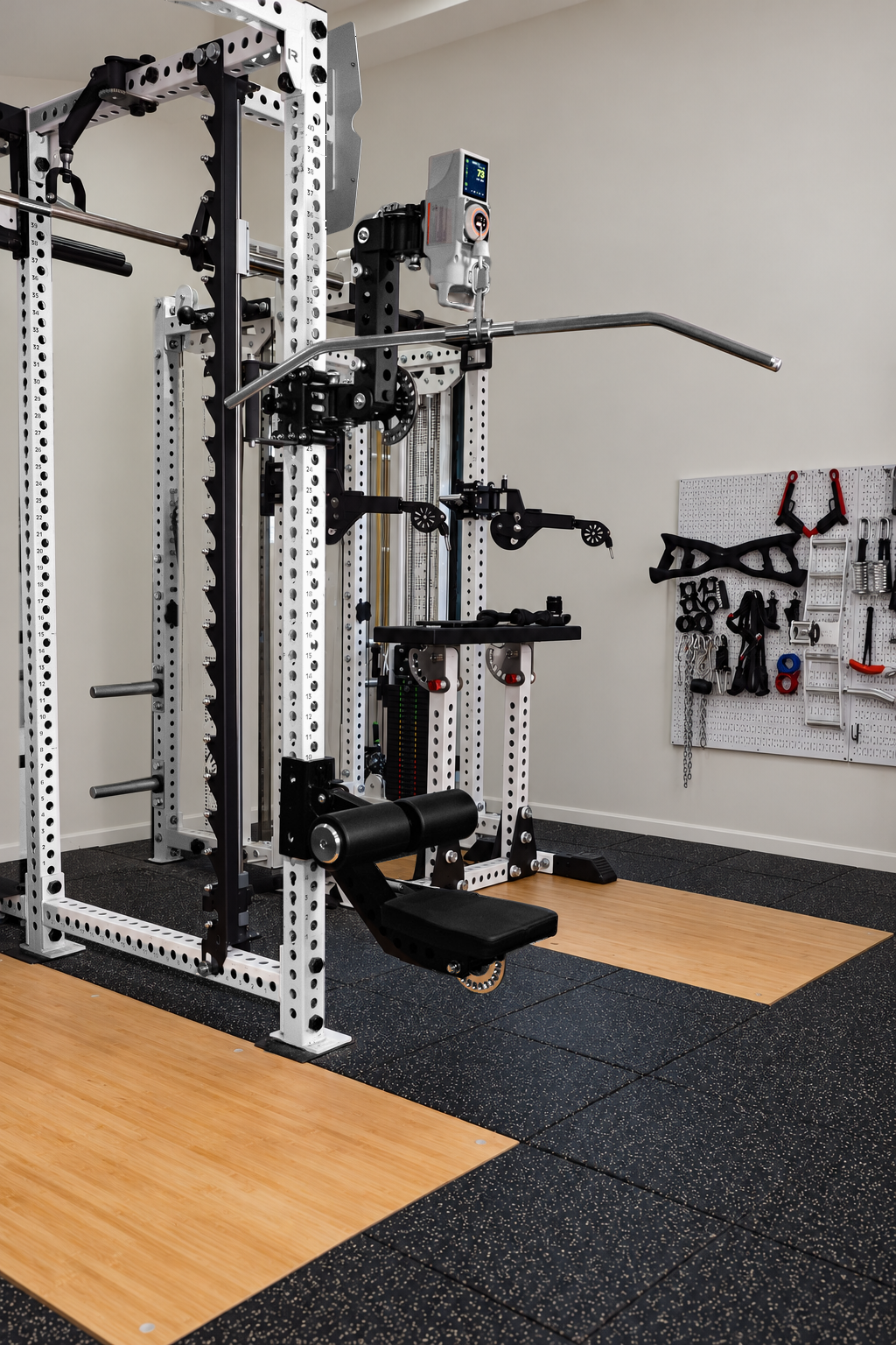 Bear Arm in a high cable setup on a power rack, shown with a VOLTRA device and lat pulldown accessories; accessories sold separately.