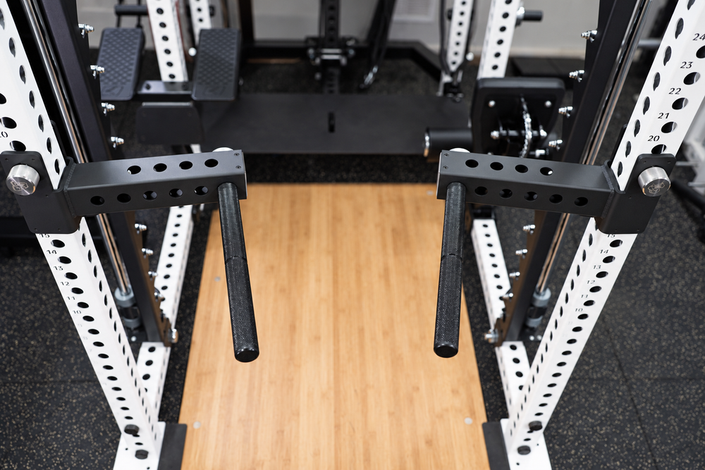 Drop-In Dip Attachment mounted between two rack uprights